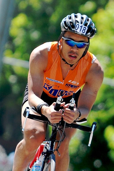 Cliff Tam riding a bike in Peterborough Half Ironman (2009?)