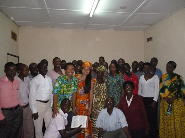 We took a picture with the students on the last day of us teaching at Bujumbura, Burundi.   We are wearing traditional Burundian wear which the students generously gave us.