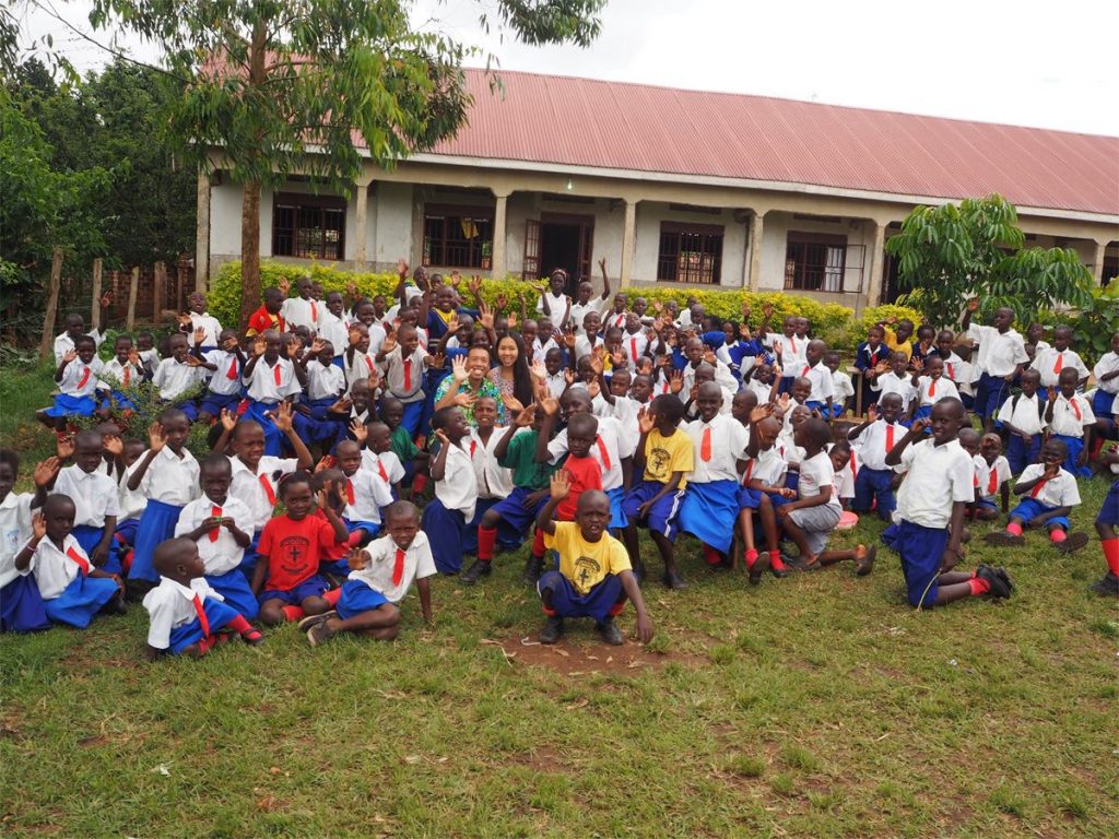 Cliff and Wai Jia with primary school children in Uganda (2014-2015).